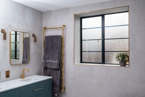 Horthorne Road windows - interior shot of a modern bathroom with black steel windows 