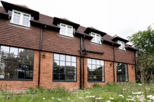 Black steel hinged doors and windows