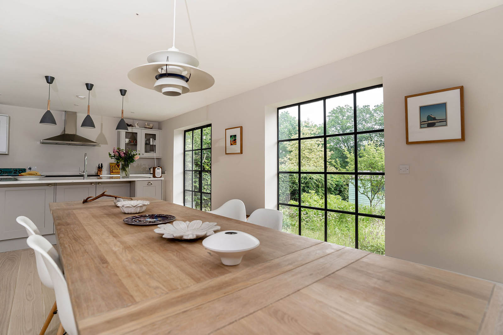 Modern dining room featuring Crittall W20 hinged door and window