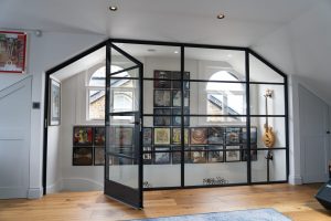 Bespoke interior Crittall fixed screen and hinged door 