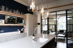 An interior view of a kitchen featuring internal hinged double doors